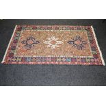 Brown ground rug having blue, green, red and cream pattern of animals with end tassels - 81" x 44.