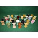 Group of thirty five small Sylvac jugs and vases of various forms and colour,