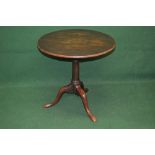 Mahogany circular tip top table the top having bird cage movement supported on a turned column