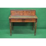 19th century mahogany writing desk having raised back housing four small drawers over leather