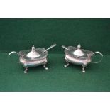 Pair of silver mustard pots with matching spoons,