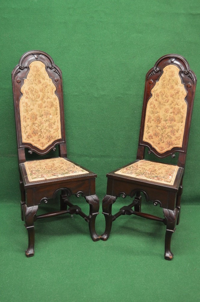 Pair of early 20th century mahogany hall/side chairs the backs having arched tops with carved