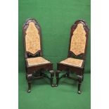 Pair of early 20th century mahogany hall/side chairs the backs having arched tops with carved