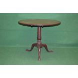 19th century mahogany circular tip top tripod table having circular top supported on a turned