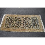 Blue ground rug having beige and brown pattern with end tassels - 83" x 39.