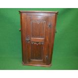 20th century oak wall hanging corner cupboard having single door with linen fold panels opening to