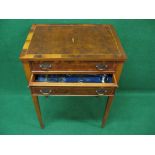 Yew wood cutlery table having two drawers opening to reveal fitted trays containing a twelve place