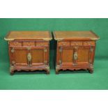 Pair of 20th century Chinese style side cabinets having brass bound corners the tops having raised
