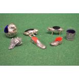 Group of five novelty silver pin cushions in the form of a frog, pig, slipper,