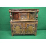 20th century oak carved court cupboard the top having moulded edge over a carved frieze supported