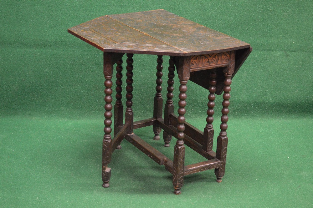 Late 19th century oak gateleg table having foliate carved top with two shaped drop leaves supported