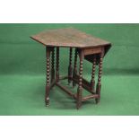 Late 19th century oak gateleg table having foliate carved top with two shaped drop leaves supported