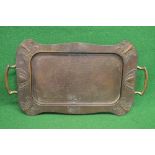 Copper Art Nouveau serving tray having raised borders with embossed decoration and hammered surface