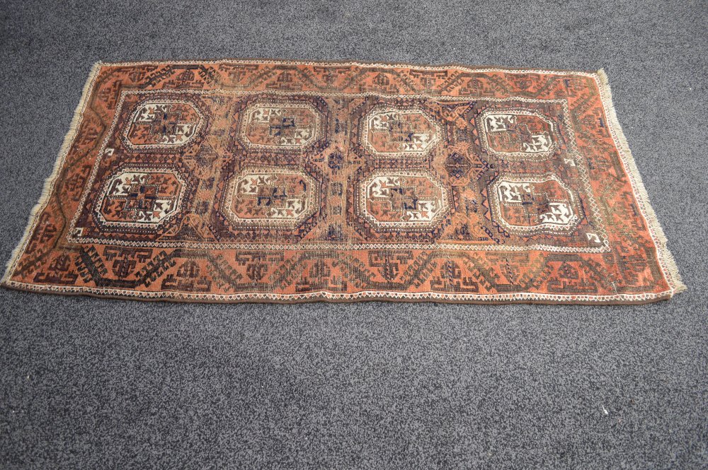 Brown ground rug having cream and blue pattern with end tassels - 76" x 40.