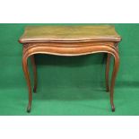 19th century rosewood fold over card table having shaped top opening to reveal green baized surface
