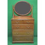 Edwardian mahogany dressing chest having oval swing mirror over two short and three long graduated
