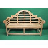 Late 20th century Lutyens style bench having arched back with scrolled arms and slatted seat,
