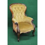 Victorian mahogany showwood framed button back armchair having scrolled arms and over stuffed bow