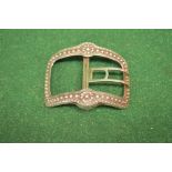 Indistinctly marked white metal belt buckle having raised decoration (gross weight 86.