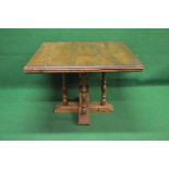 Possibly elm square occasional table the top having moulded edge supported on central square