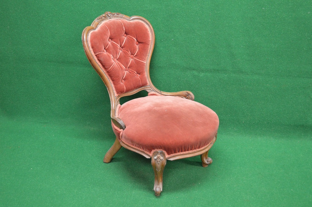 Victorian mahogany nursing chair having shaped show wood frame back with buttoned upholstery over