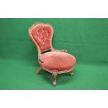Victorian mahogany nursing chair having shaped show wood frame back with buttoned upholstery over