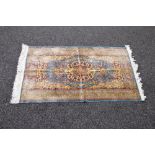 20th century blue ground rug having red, blue and beige pattern with end tassels - 49" x 27.
