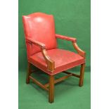 20th century Georgian style mahogany Gainsborough chair having hump back over open padded arms with