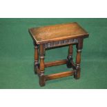 20th century oak joint stool having rectangular top over a carved frieze supported on turned and