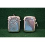 Two silver vesta cases one having engraved decoration of leaves,