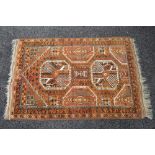 Rust ground rug having cream and brown pattern with end tassels - 57" x 36"