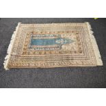 20th century beige ground rug having blue, pink and cream pattern with end tassels - 75" x 47.