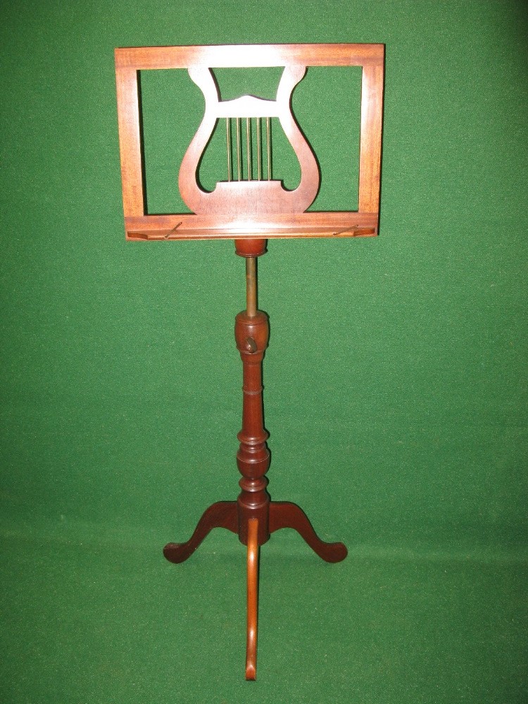 20th century mahogany music stand having lyre formed book rest supported on telescopic brass column