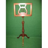 20th century mahogany music stand having lyre formed book rest supported on telescopic brass column