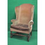 Mahogany high wing back armchair having arched top and scrolled arms with removable seat cushion,