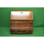 Oak bombe bureau having fall front opening to reveal fitted interior of pigeon holes,
