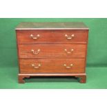Victorian mahogany chest of three long graduated drawers having brass handles and escutcheons,