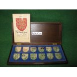 Set of twelve cased Sterling silver Royal Arms Shields together with information sheets,