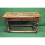 18th century oak single plank top side table the top being supported on a carved frieze and turned