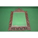 Oak carved black forest wall mirror having foliate pierced carved frame with carved lion and