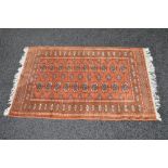 Brown ground rug having cream and blue pattern with end tassels - 51" x 32"