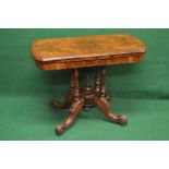 Victorian walnut fold over card table the top having inlaid decoration with moulded edge opening to