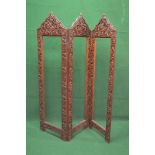 Mahogany heavily carved three fold screen frame having arched tops with foliate carved decoration -