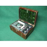 Mahogany brass bound travel case the top opening to reveal fitted interior with silver plated