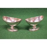 Pair of boat shaped silver salts standing on oval bases,