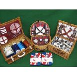 Three different wicker picnic hampers with contents together with two Team GB insulated lunch box