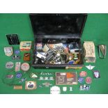 Metal box containing a quantity of mixed loose automobilia including: manufacturers badges,