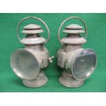 Two French paraffin lamps with side slot mounts and top handles,