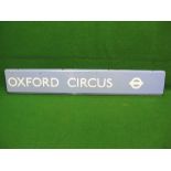 Heavy modern pale blue (Victoria Line) London Underground station sign for Oxford Circus with white