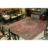 Large vintage red ground carpet